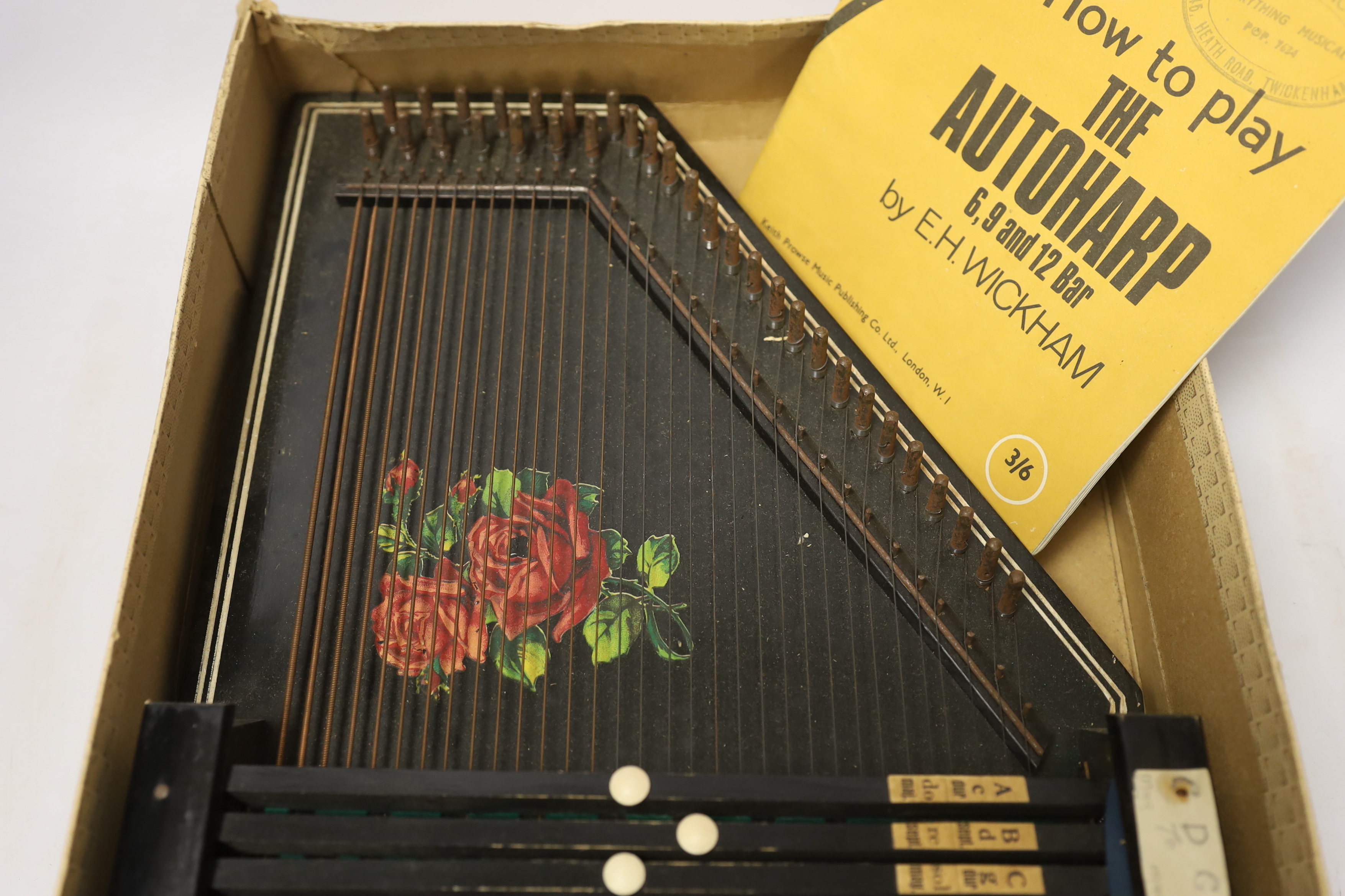 An autoharp in original box with booklet
